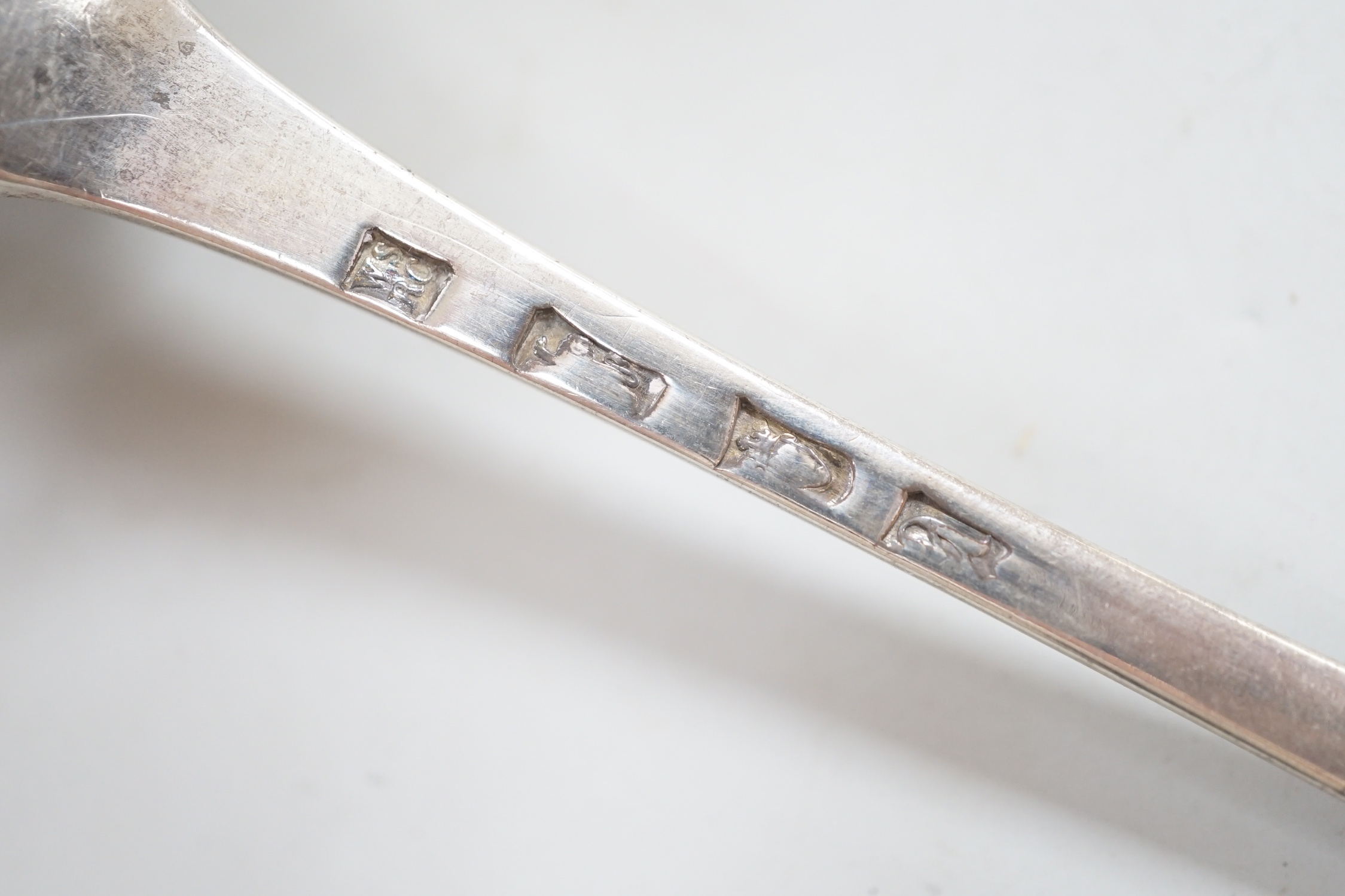 A George III silver Old English pattern bright cut engraved silver basting spoon, Sumner & Crossley, London, 1776 and a later repousse heart shaped trinket box.